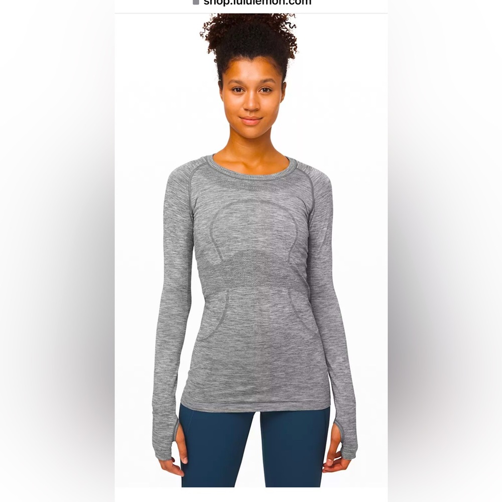 Size 2 Lululemon swiftly tech long sleeve. OLD STYLE. good condition.